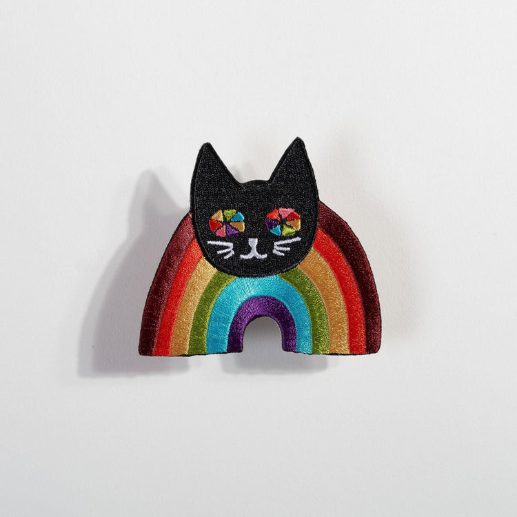Rainbow Cat Patch with black cat head and colorful rainbow stripes on an embroidered fabric accessory
