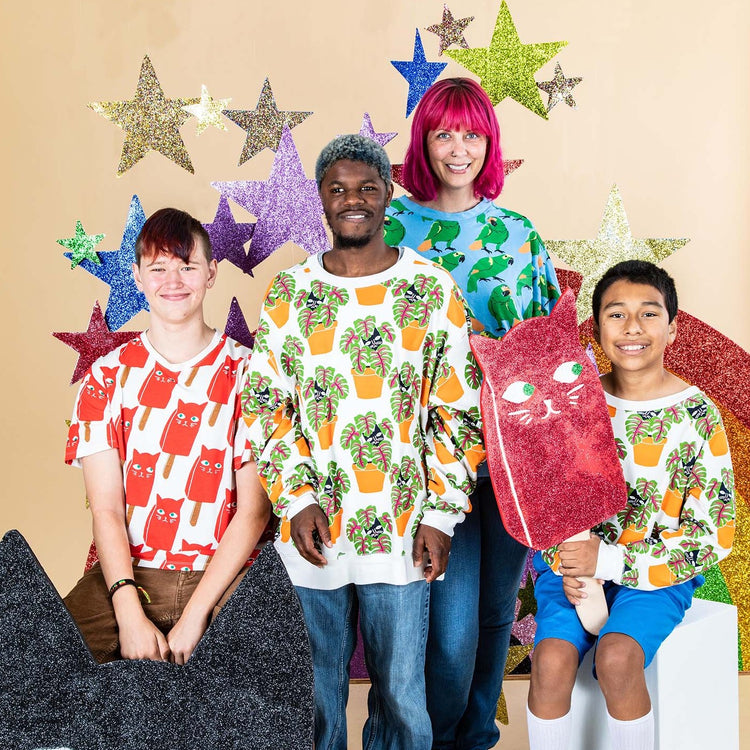 Adult Cat in Pot Sweatshirt worn by diverse group with fun star backdrop in playful casual style